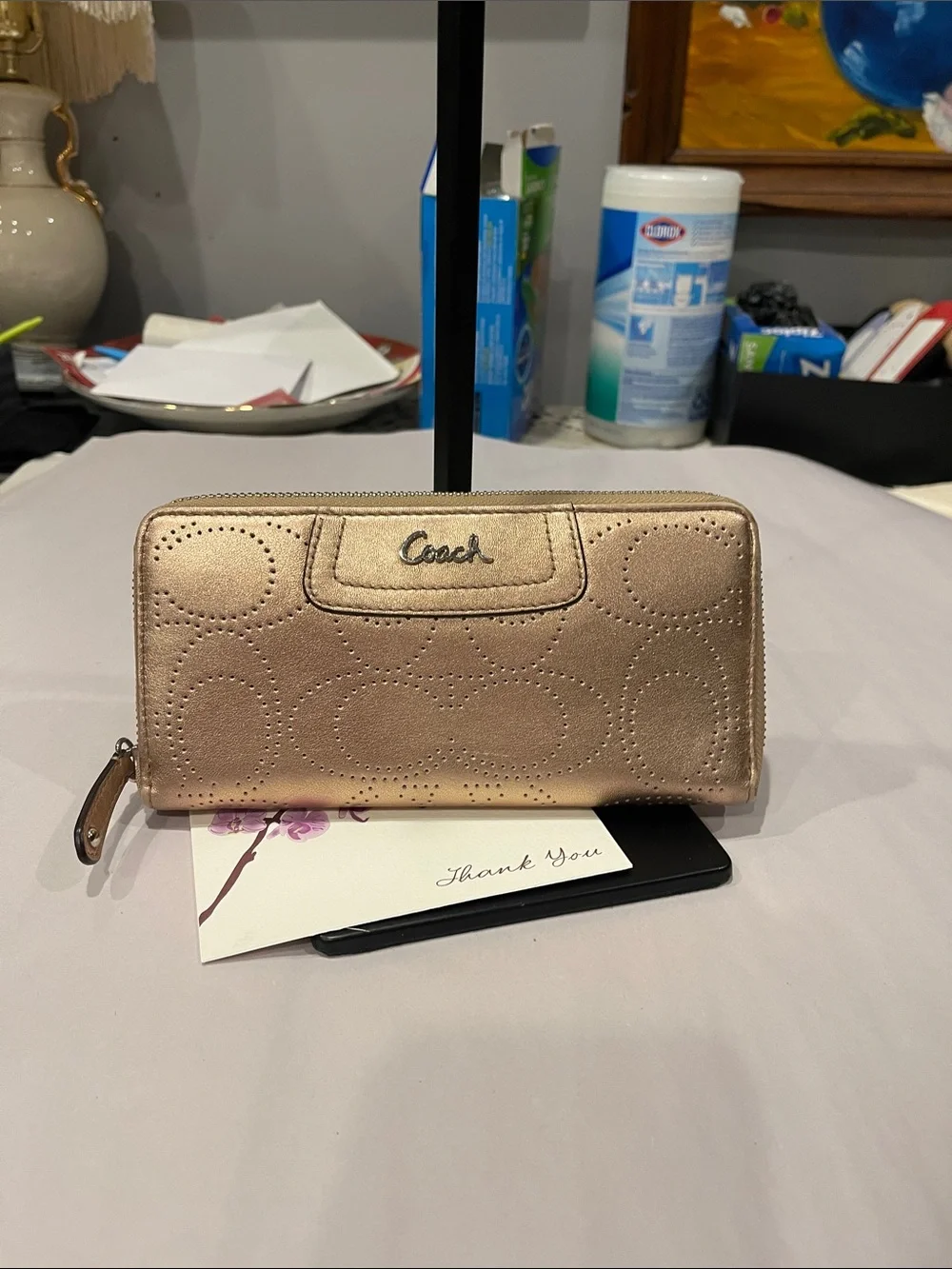 Coach Ashley perforated zip-around wallet.